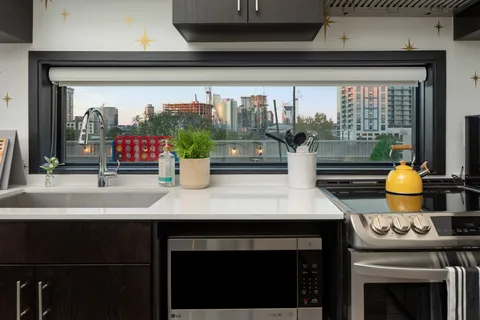 a kitchen with a stove and a microwave