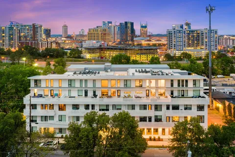 a view of a tall building and a city view