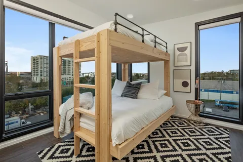 a bed room with a bed and a book shelf