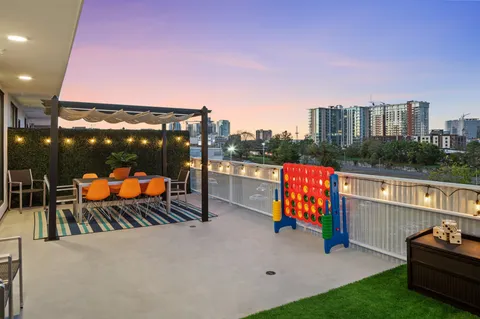 a patio with table and chairs