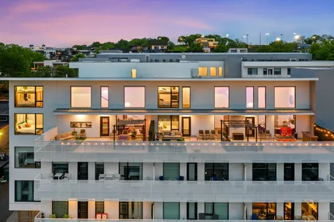 a front view of a house with a lake view