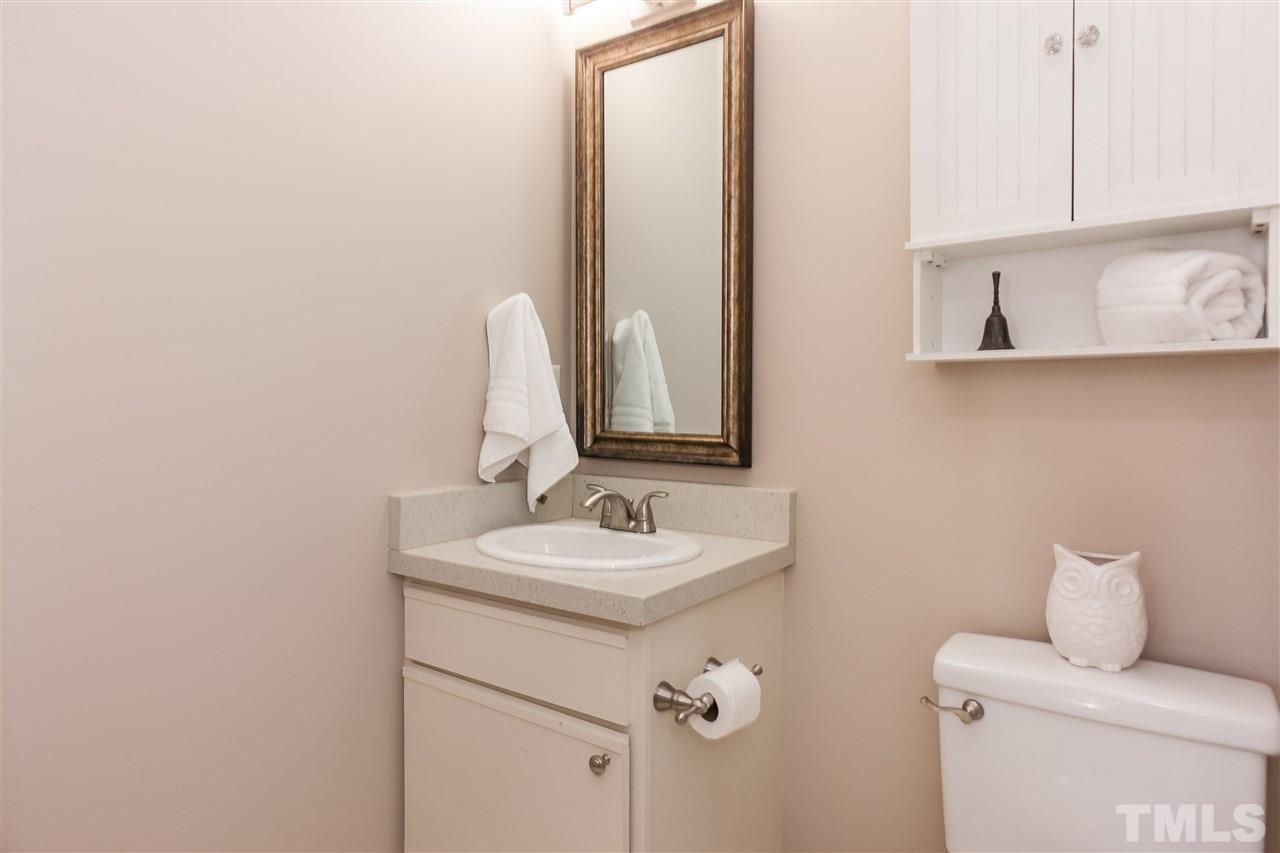 2608 Sterling Park Drive Raleigh, NC 27603 - Photo 17 of 21 a bathroom with a sink and a mirror