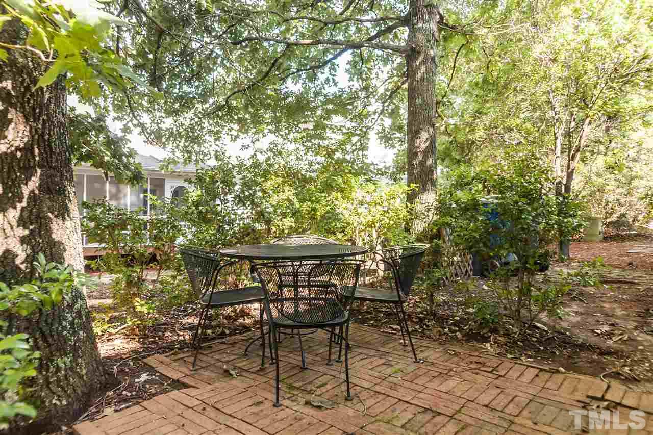 2608 Sterling Park Drive Raleigh, NC 27603 - Photo 18 of 21 a view of patio with table and chairs and potted plants