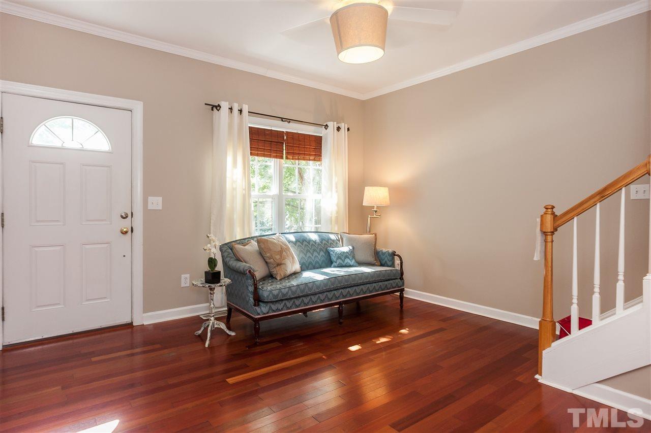 2608 Sterling Park Drive Raleigh, NC 27603 - Photo 3 of 21 a living room with furniture and a wooden floor