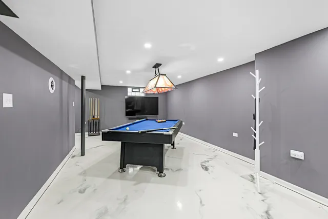 a view of a room with a table and chairs