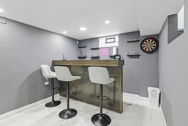 a kitchen with a table and chairs in it