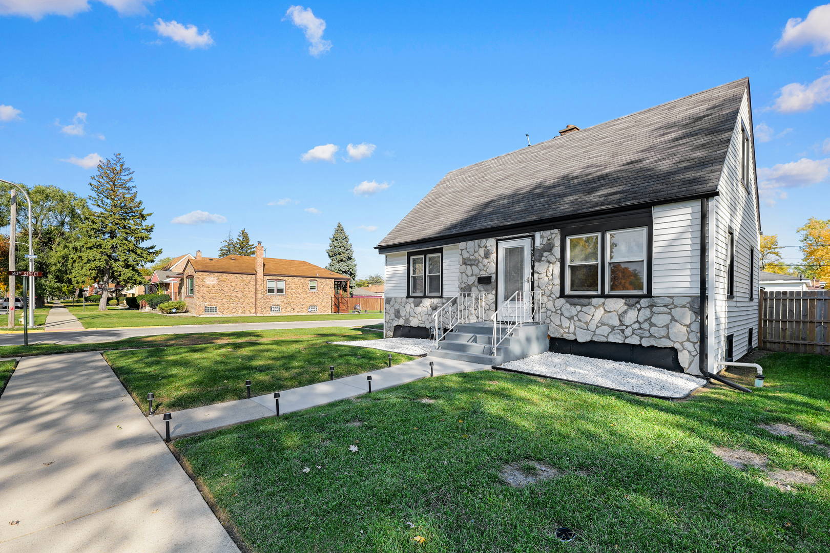 14301 Parnell Avenue Harvey, IL 60426 - Photo 2 of 17 a front view of a house with garden