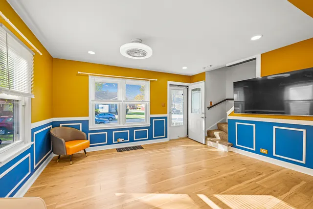 a bedroom with furniture and a flat screen tv
