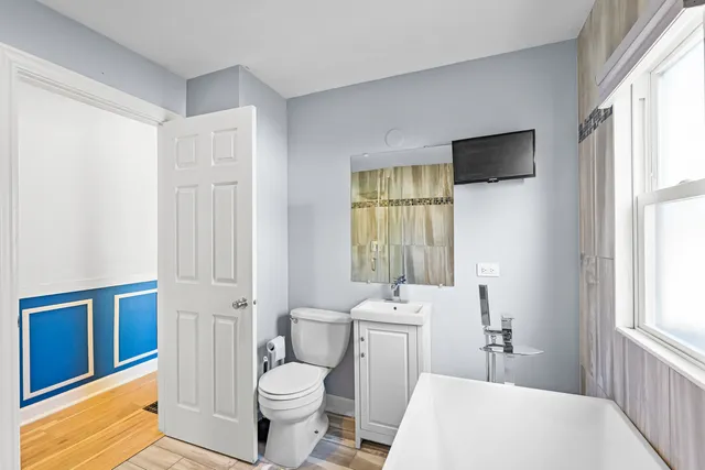 a bathroom with a toilet sink and a bathtub