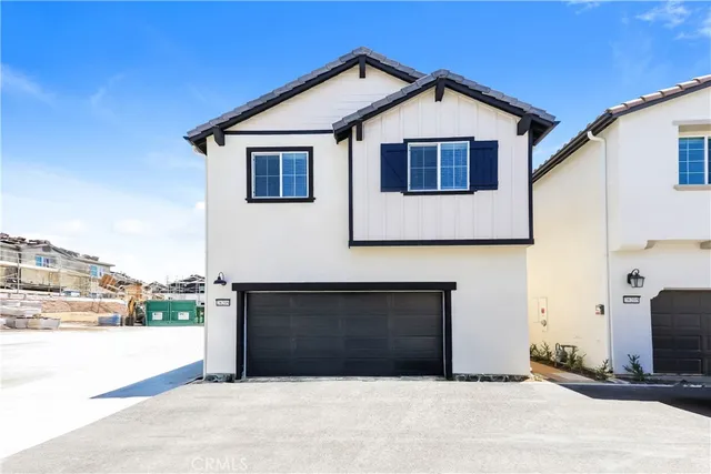 a front view of a house with a garage