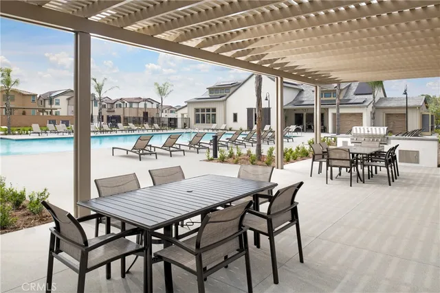 a view of a patio with a table and chairs