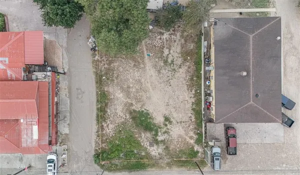 an aerial view of a house with outdoor space
