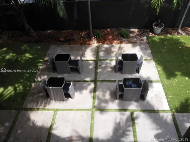 a view of a balcony with chairs