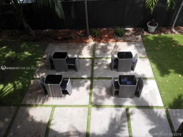 a view of a balcony with chairs
