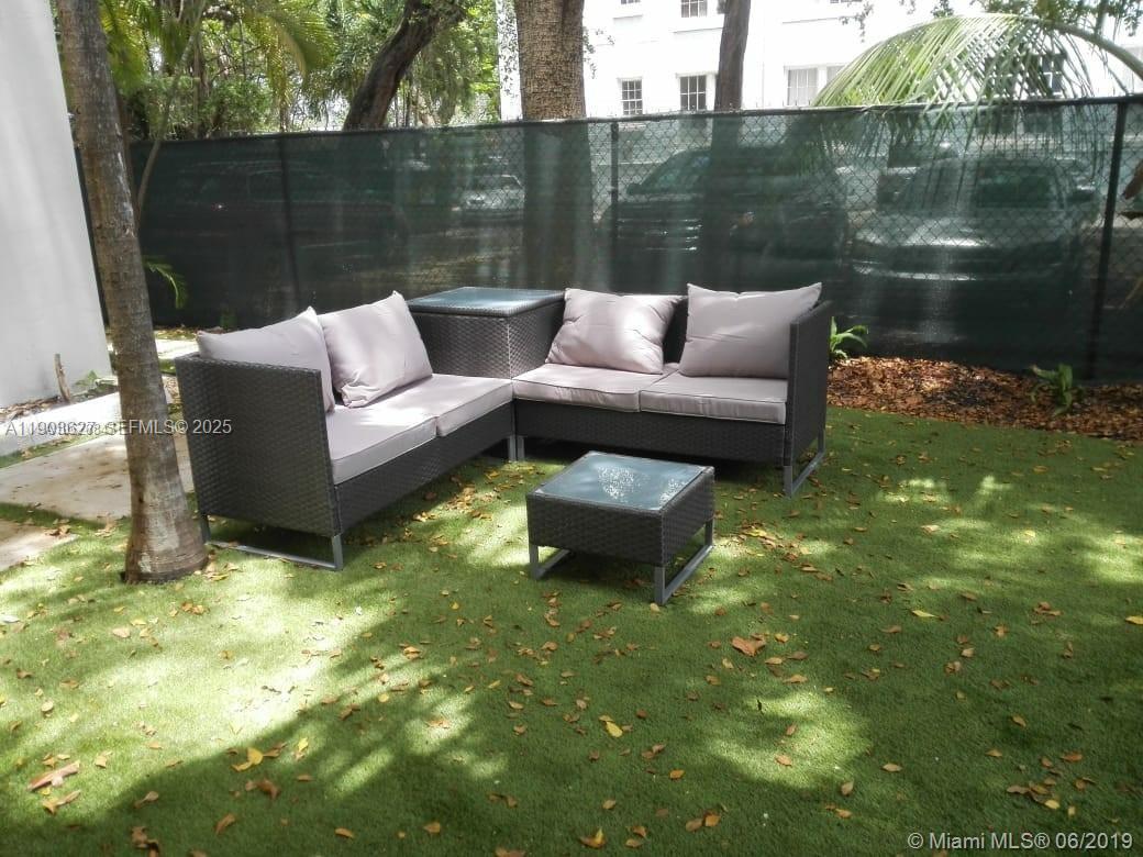 245 Northeast 33rd Street, Unit 106 Miami, FL 33137 - Photo 9 of 13 a garden view with a lake view