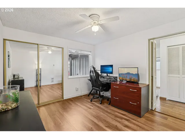 a workspace with furniture and wooden floor