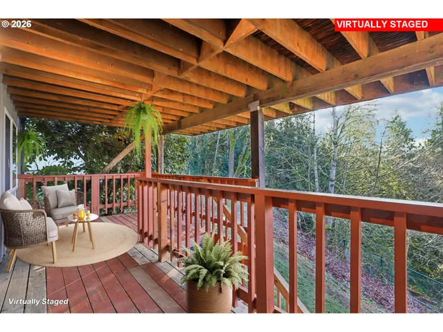 a view of balcony with wooden floor and outdoor seating