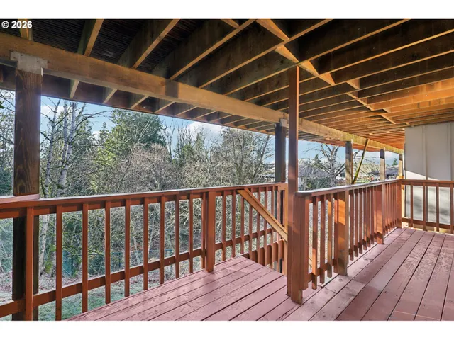 a view of balcony with wooden floor