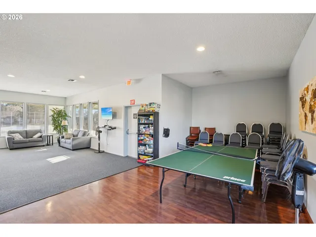 a living room with furniture and a table