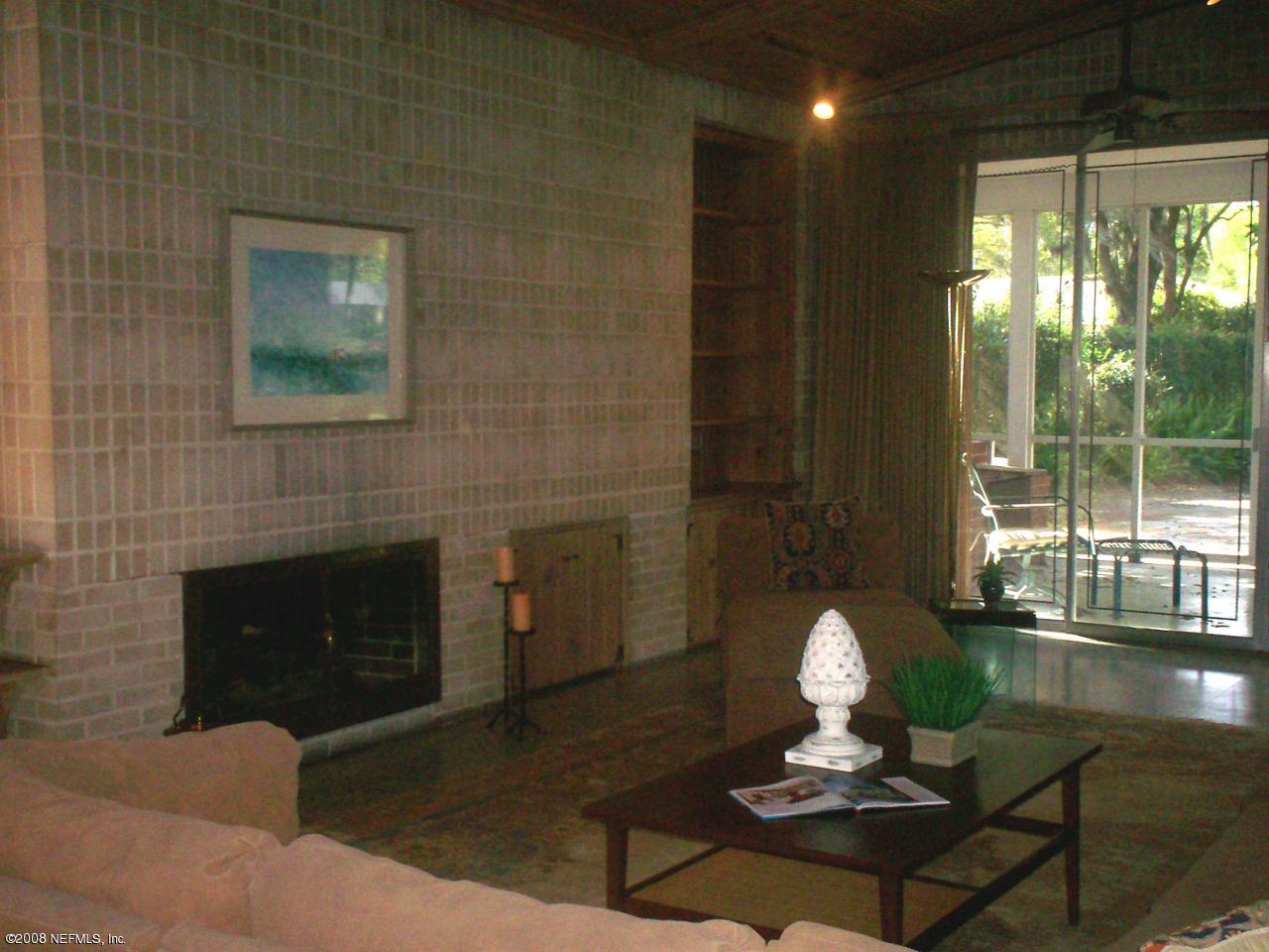 906 Waterman Road North Jacksonville, FL 32207 - Photo 3 of 23 a living room with furniture a window and a fireplace