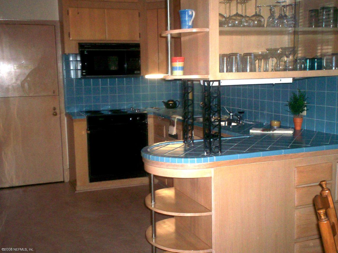 906 Waterman Road North Jacksonville, FL 32207 - Photo 8 of 23 a kitchen with a sink and a stove