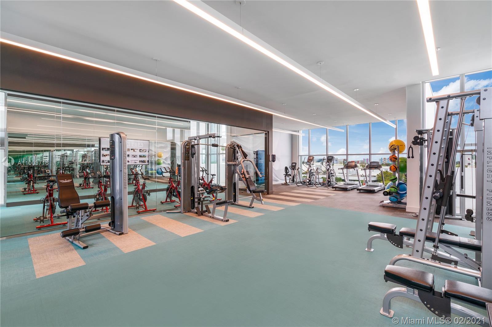 3900 Biscayne Boulevard, Unit N723 Miami, FL 33137 - Photo 12 of 15 a view of a room with gym equipment