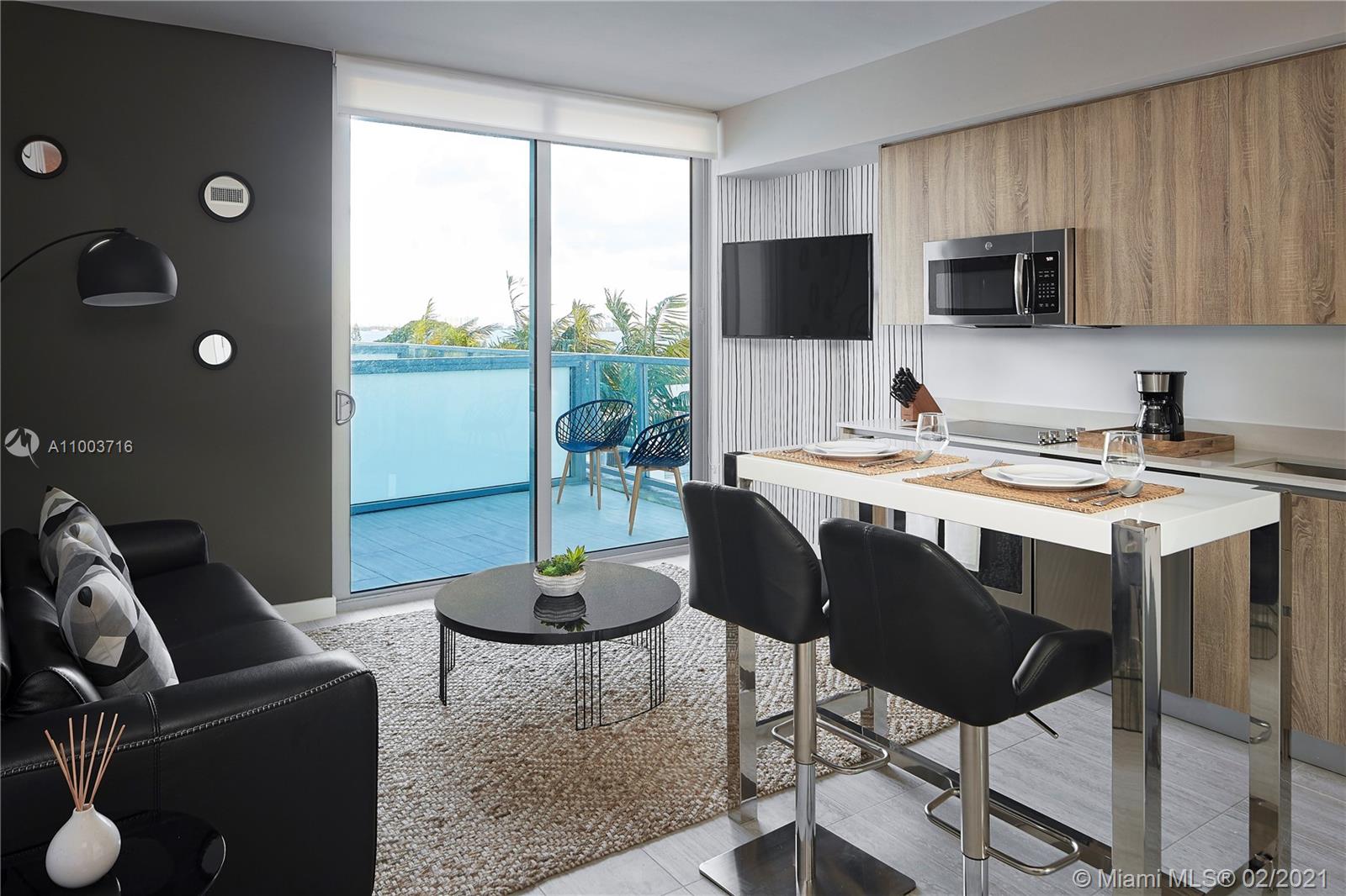 3900 Biscayne Boulevard, Unit N723 Miami, FL 33137 - Photo 15 of 15 a view of a dining room with furniture window and outside view