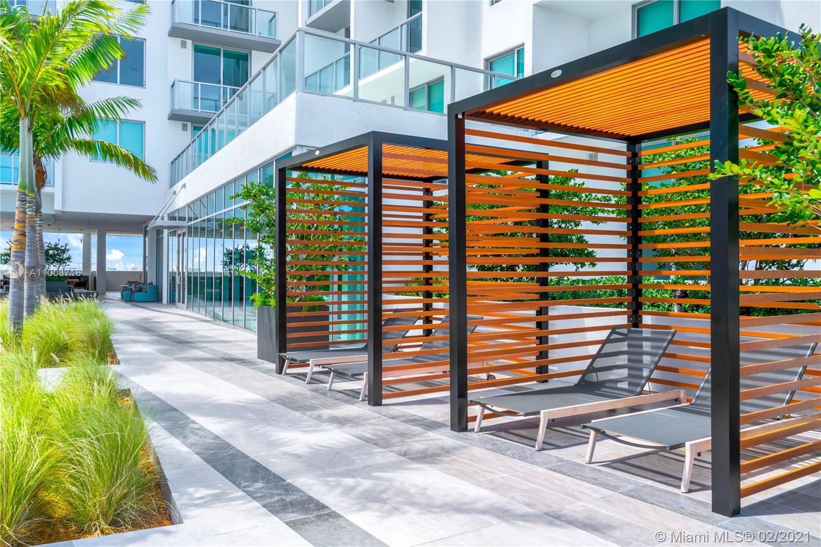 3900 Biscayne Boulevard, Unit N723 Miami, FL 33137 - Photo 4 of 15 a front view of a building with garden