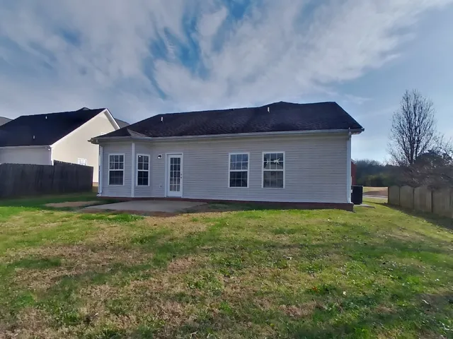 a backyard of a house with seating space