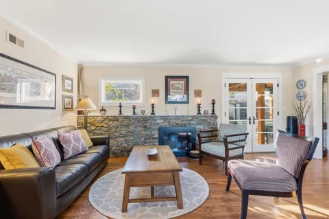 a living room with furniture and a table