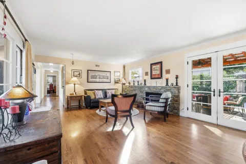 a living room with furniture and a table