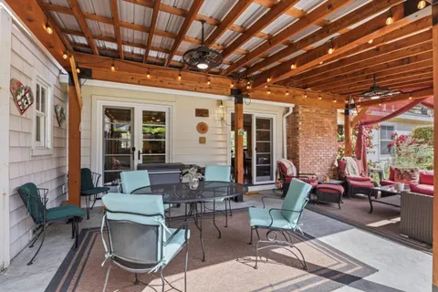 a living room with furniture and a garden