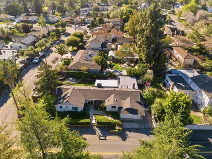 an aerial view of a house with a garden