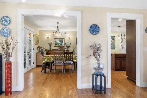 a view of a livingroom with furniture and hardwood floor