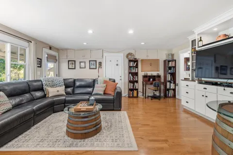 a living room with furniture and a table