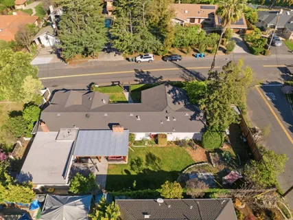 an aerial view of residential houses with outdoor space