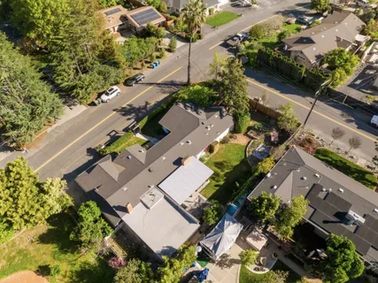an aerial view of a house with a garden