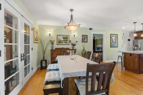 a bathroom with a granite countertop sink mirror and a bathtub