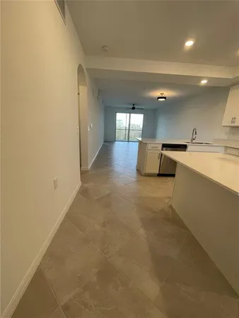 a view of a livingroom and a kitchen