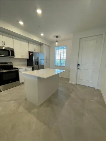 a view of empty room with windows