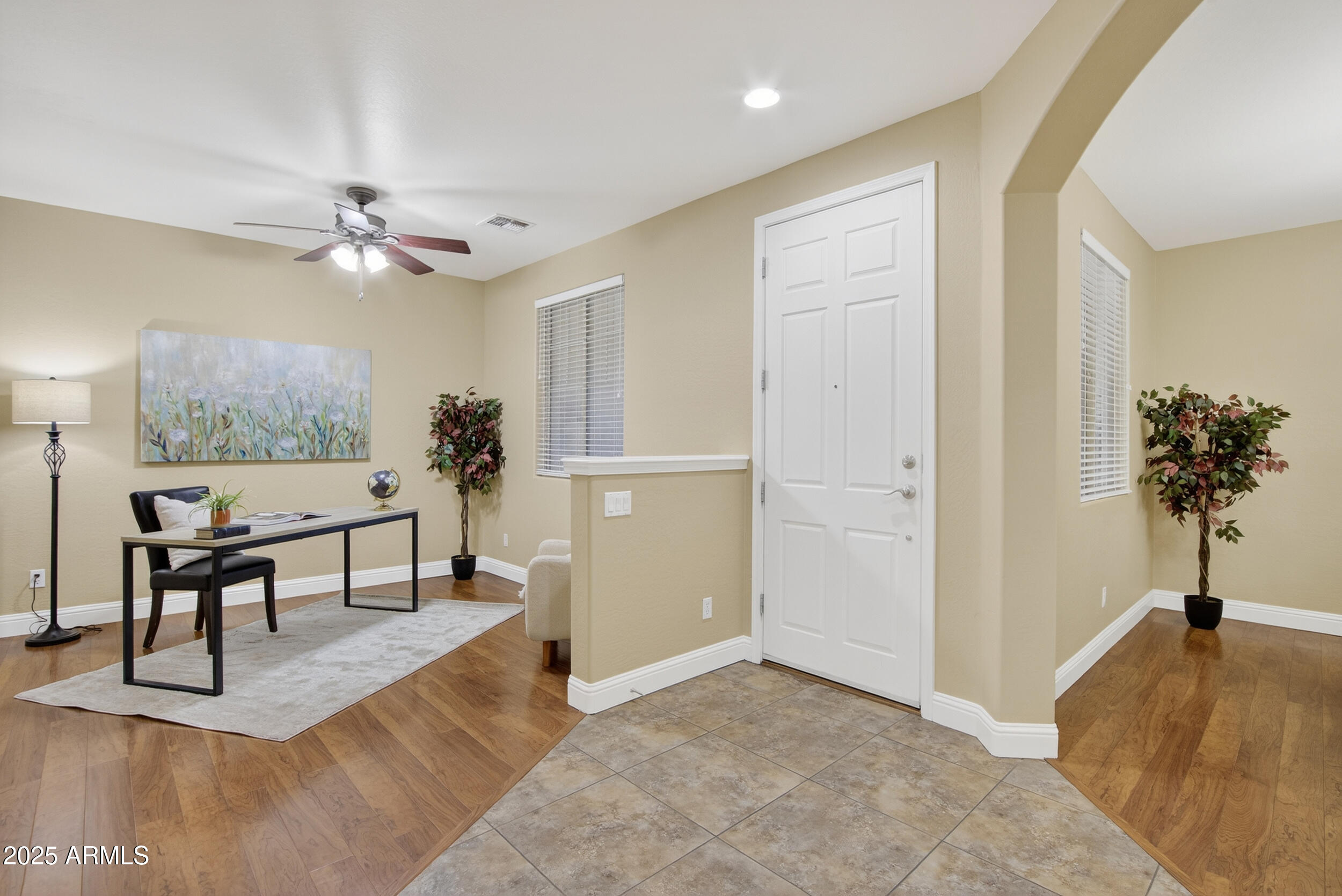 17368 West Red Bird Road Surprise, AZ 85387 - Photo 15 of 82 a view of a livingroom with furniture and a potted plant