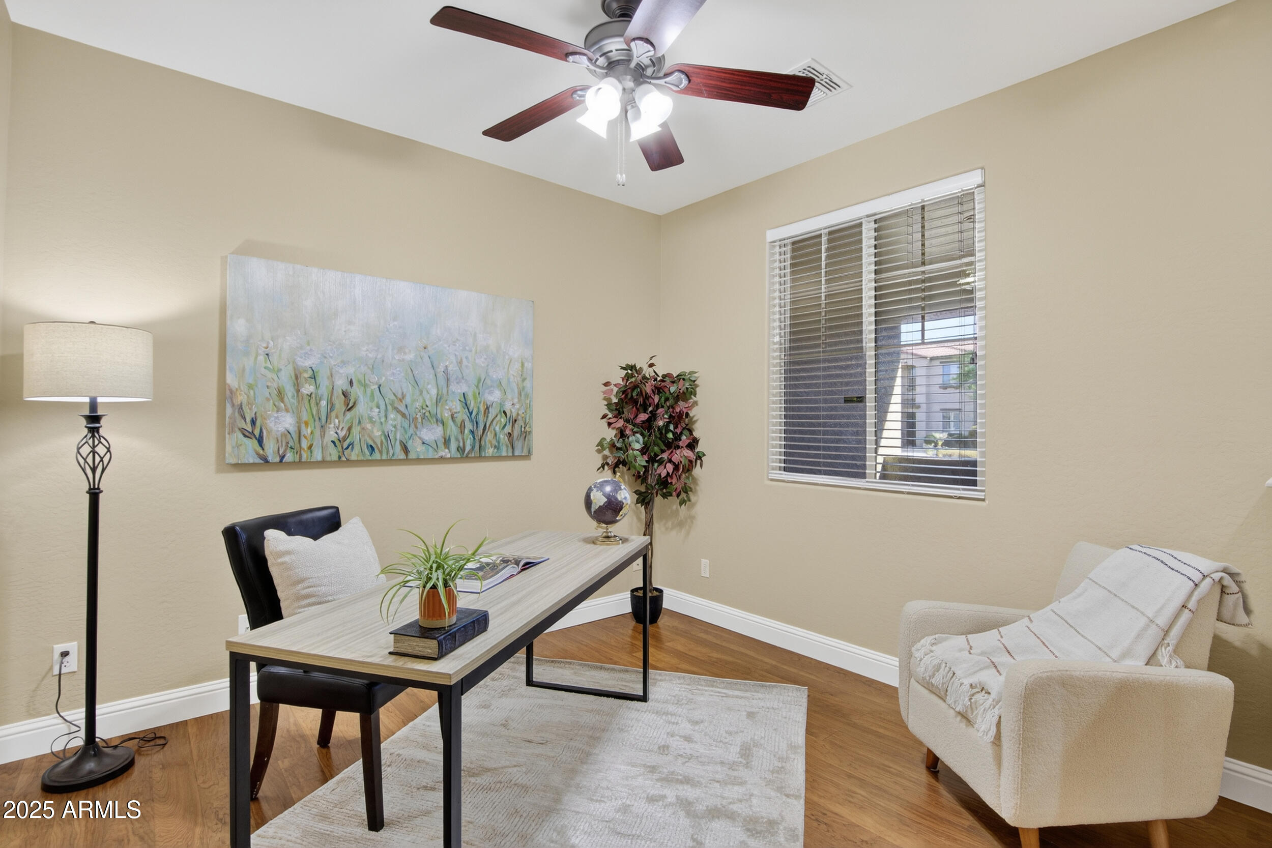 17368 West Red Bird Road Surprise, AZ 85387 - Photo 16 of 82 a living room with furniture and a potted plant