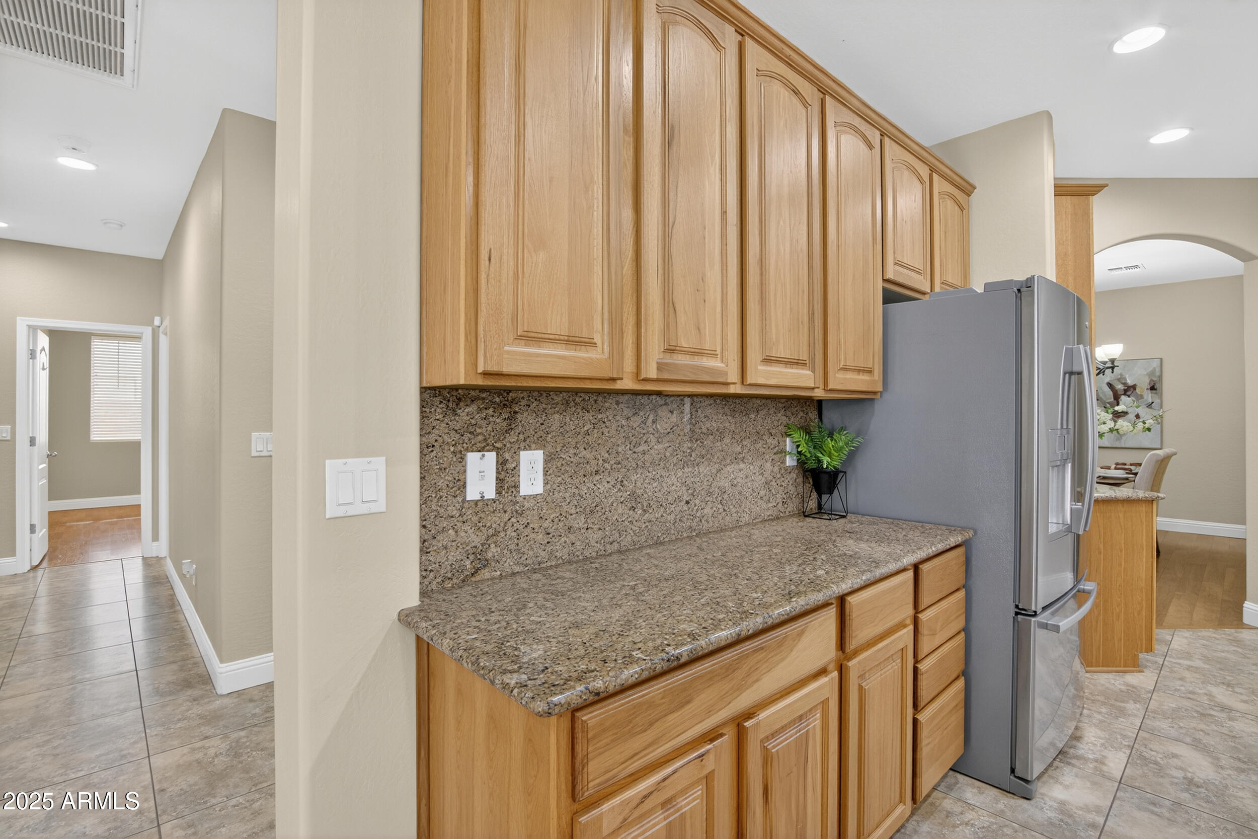 17368 West Red Bird Road Surprise, AZ 85387 - Photo 22 of 82 a kitchen with stainless steel appliances granite countertop a refrigerator and a stove