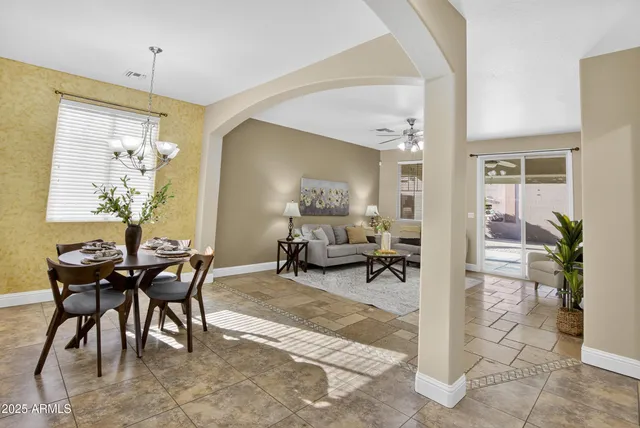 a bedroom with furniture and a wooden floor