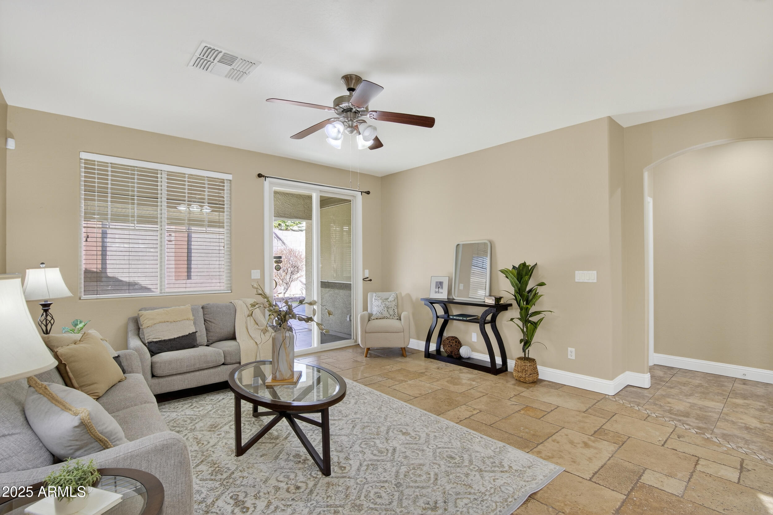 17368 West Red Bird Road Surprise, AZ 85387 - Photo 26 of 82 a living room with furniture or couch and a window
