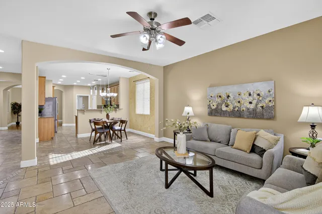 a bathroom with a granite countertop sink a toilet and a mirror