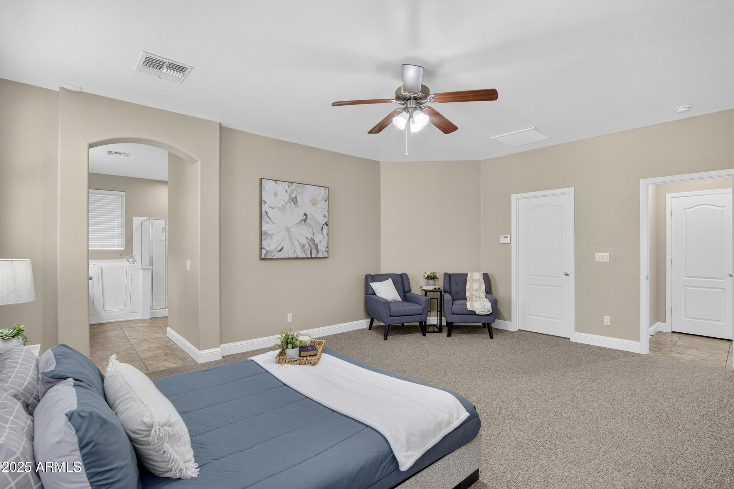 17368 West Red Bird Road Surprise, AZ 85387 - Photo 32 of 82 a bedroom with a bed and couch