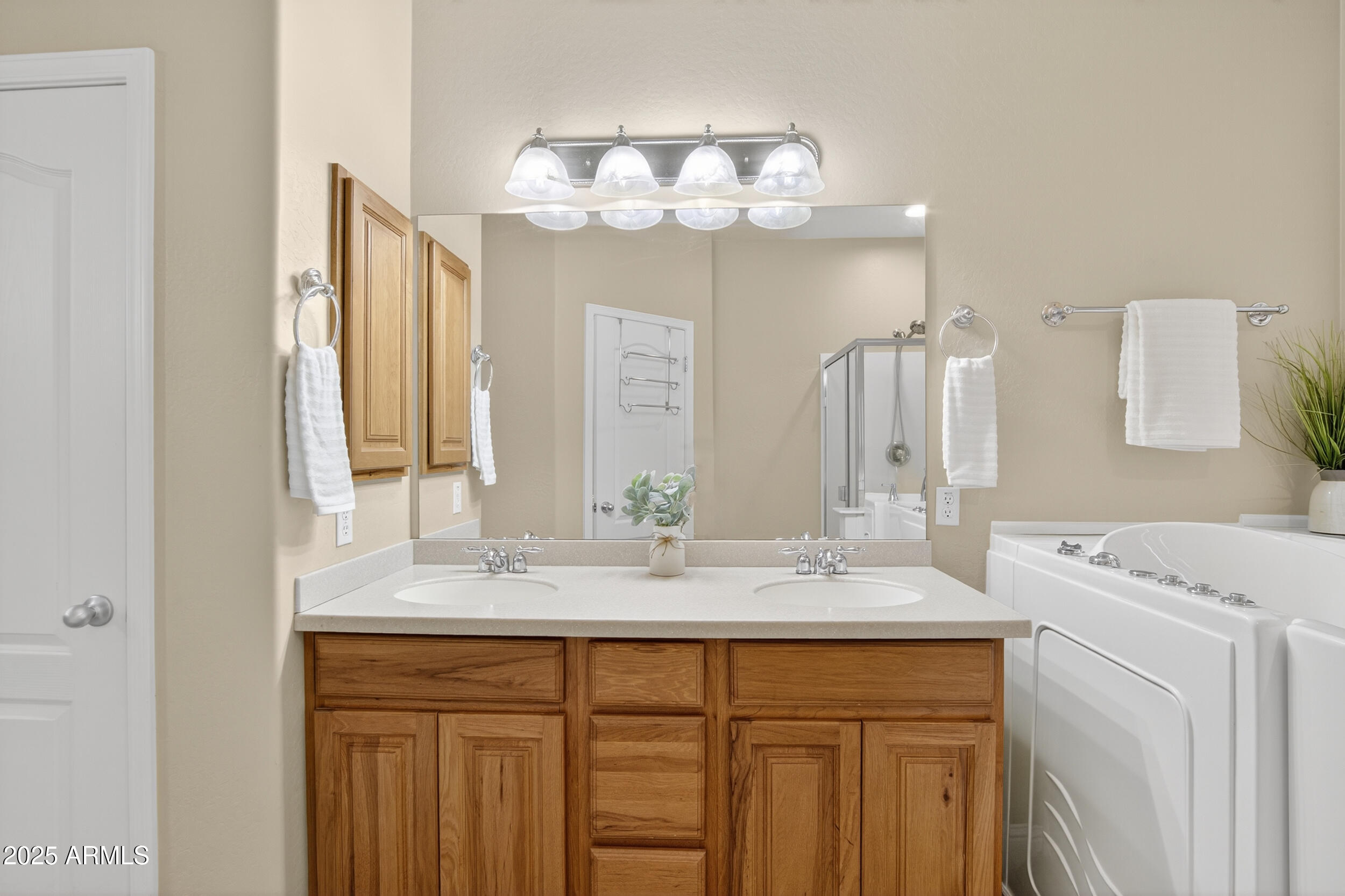 17368 West Red Bird Road Surprise, AZ 85387 - Photo 36 of 82 a bathroom with a sink a vanity and a mirror