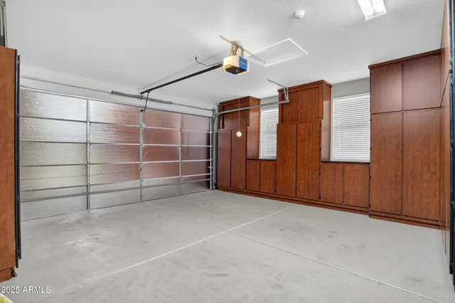 an aerial view of residential houses with outdoor space and street view