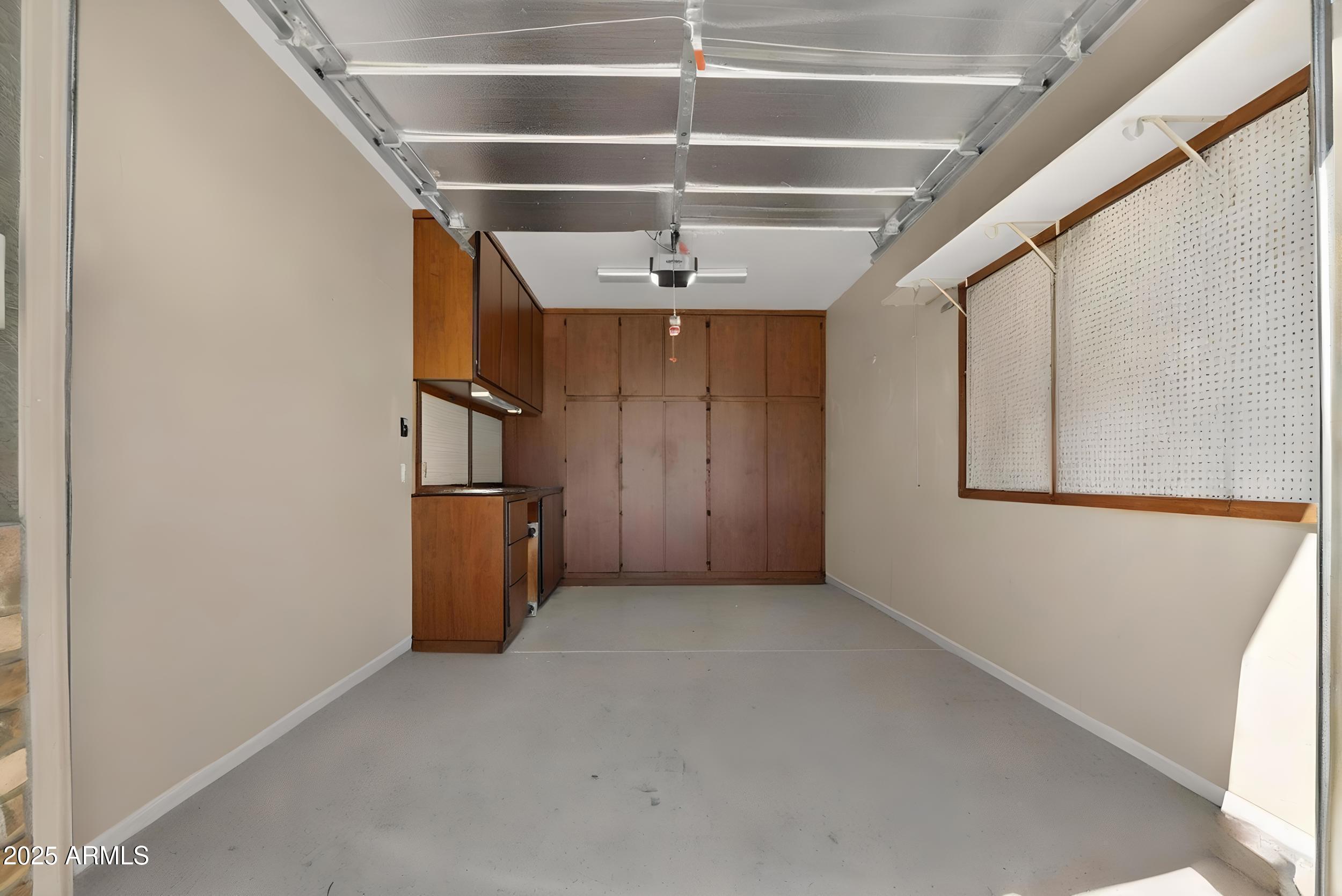 17368 West Red Bird Road Surprise, AZ 85387 - Photo 52 of 82 a view of a livingroom with a ceiling fan and window